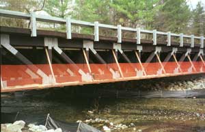 photo of a bridge with ripping asphalt