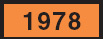 Image of an identification number on a rectangular orange-colored panel sign. The identification number is 1978.