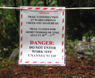Photo of a sign warning people that work is occuring in the area.
