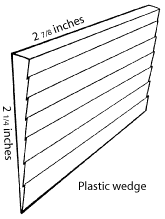 Image of a plastic wedge used for securing tool heads.