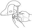 Illustration of hands held under a sensory-operated faucet, with water pouring from the spout.