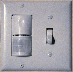 Photo of a light switch that includes an occupancy sensor on it.
