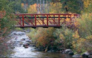 Photo of a stock bridge over a stream.