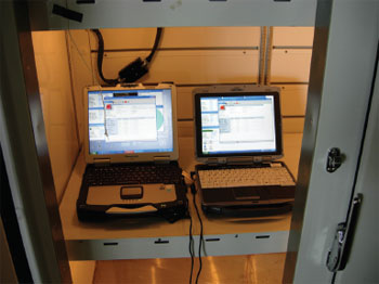 Photo of the two laptops in the environmental chamber.