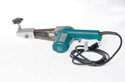 Photo of a narrow belt sander with the new bracket attached to it.