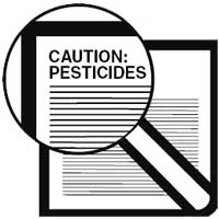 Drawing of a magnifying glass that is magnifying the words, Caution:Pesticides.