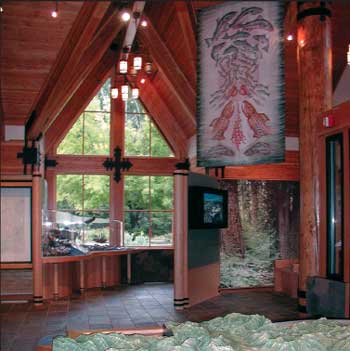 Photo of the interior of the MacKenzie River Ranger Station. The station is made up of wood walls and slate floors.
