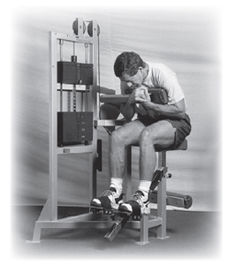 Photo of a man doing crunches on a machine.