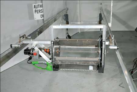 Photo of the cutter/reel assembly mounted on the pruner rails. 