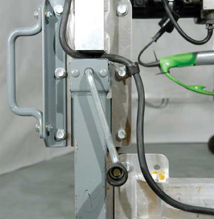 Photo of the crank handle on the master control box which is located at the end of the pruner. The photo also shows where the electrical wire is routed around those parts.