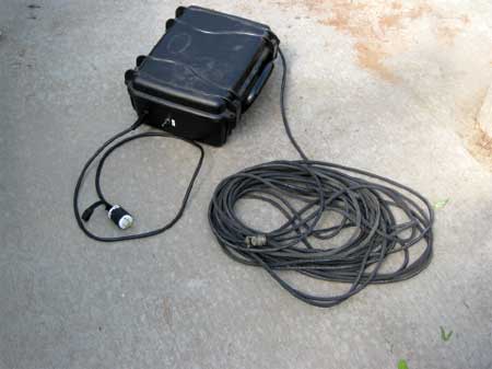 Photo of the voltage transformer box with it's attached electrical cord.