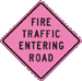 Pink diamond-shaped sign that reads, Fire Traffic Entering Road.