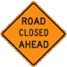 Orange diamond-shaped sign that reads, Road Closed Ahead.