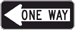 Black and white rectangular-shaped sign with an arrow pointing left with the text, One Way, inside the arrow.
