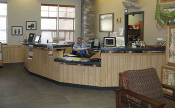 Image of a worker at the front desk of a district office.