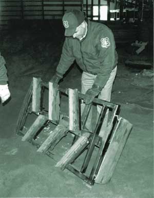 Photo of Dick Dufourd inspecting “Big Bertha”.