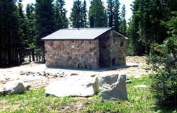 Photograph of an outdoor restroom in the summer.