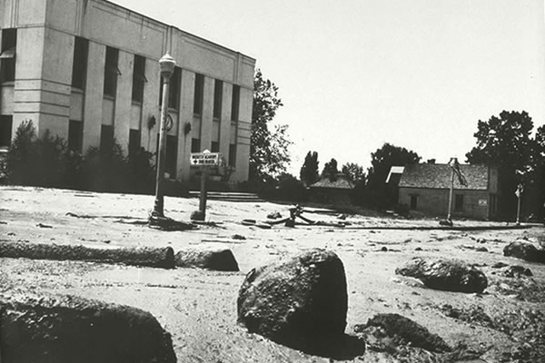 Floods deposited sediment and debris washed into Mt. Pleasant, Utah, streets.